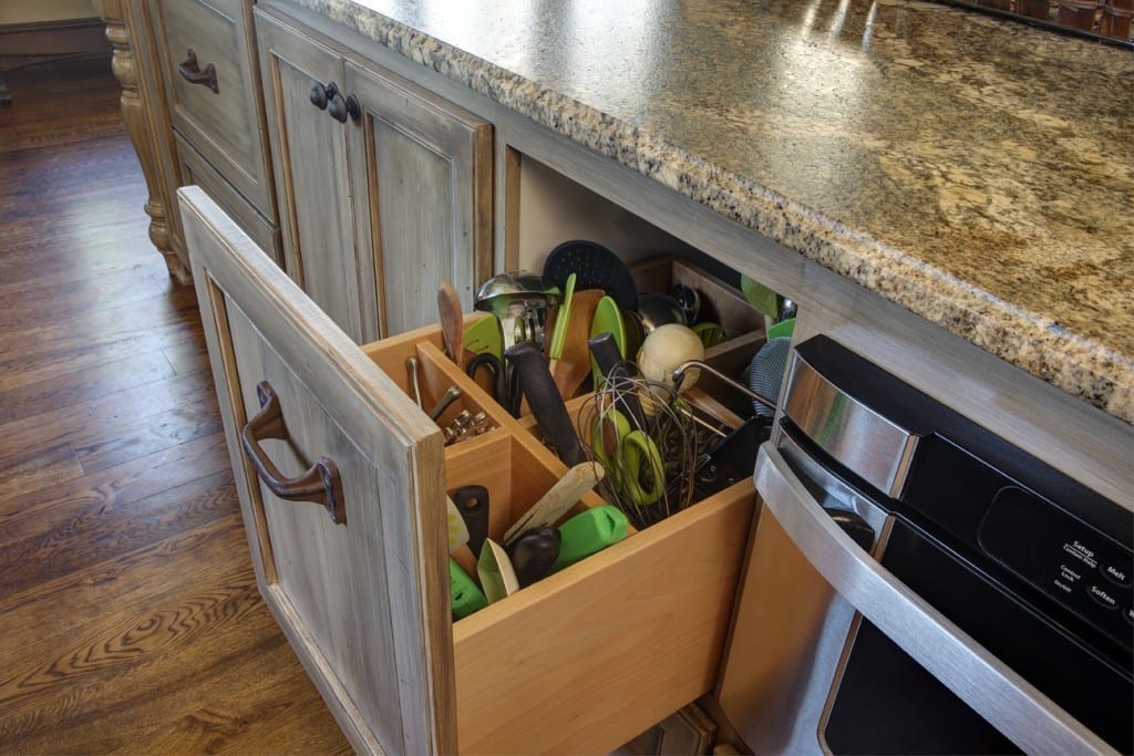 picture of an open kitchen drawer with supplies in it