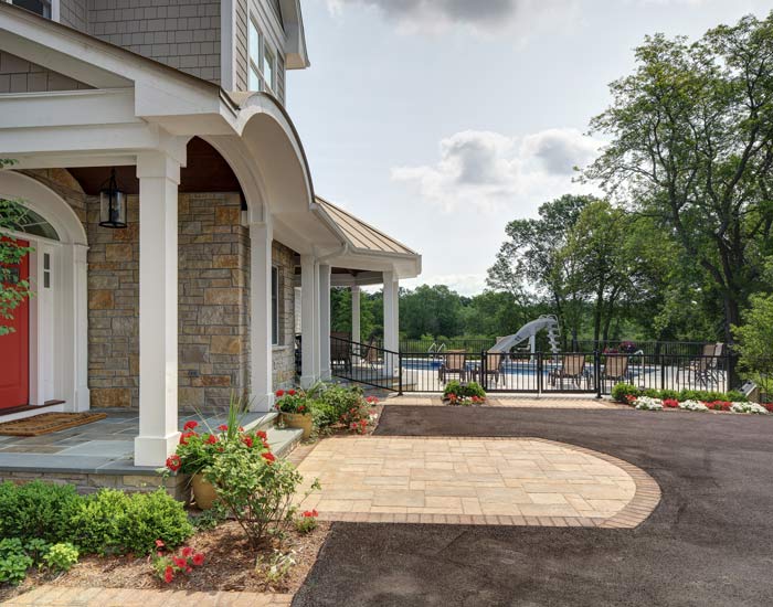 picture of a home's front porch and outdoor pool
