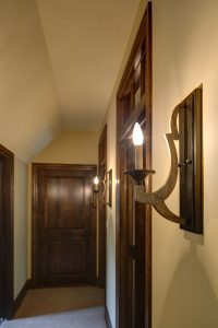 wooden sconce with a candle in a hallway