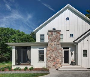 picture of a white home with a stone fireplace