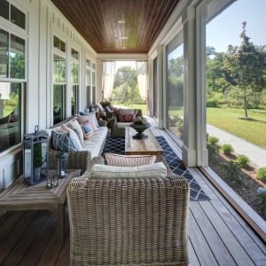 picture of a porch with chairs and couches