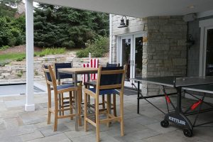 picture of an outdoor patio with a table and chairs