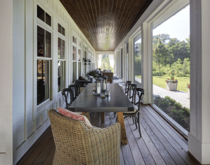 picture of a porch with tables and chairs