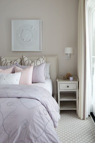 picture of a bedroom with pink and mauve accents