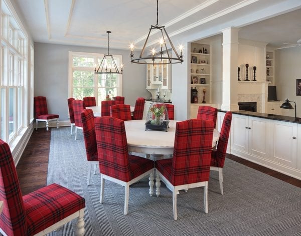 picture of a dining room with red chairs