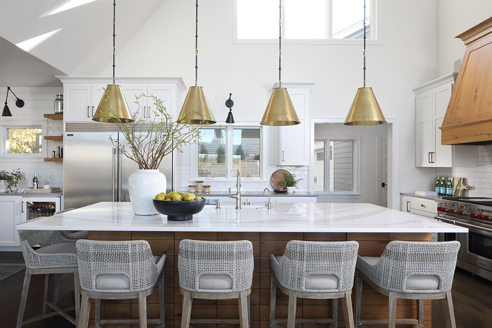 picture of a white kitchen with island and chairs