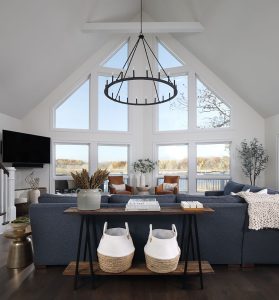 picture of a living room with large windows and couch