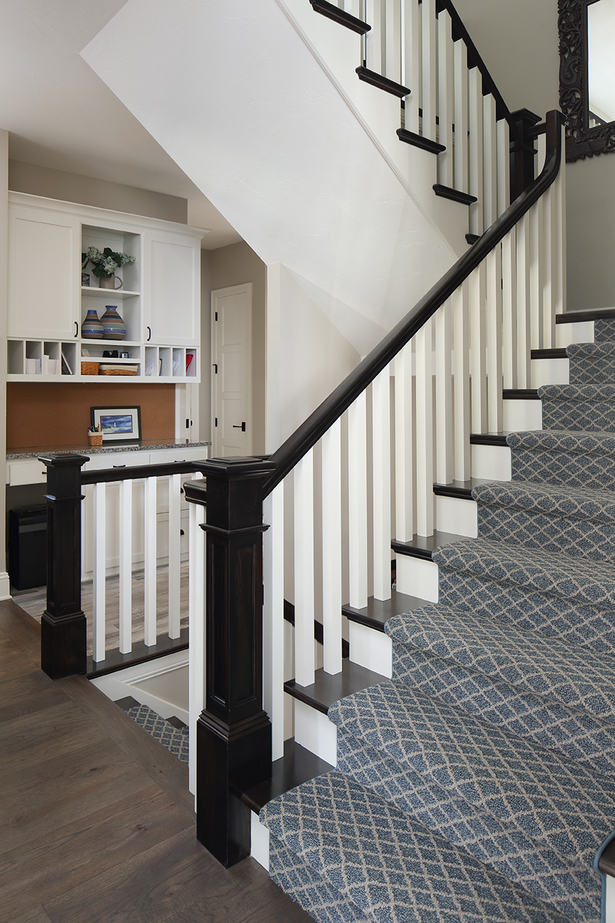 picture of a staircase with a patterned rug