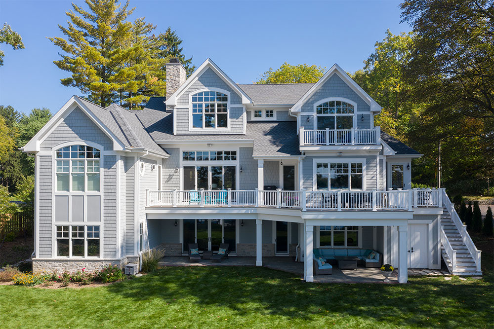 picture of a gray home with a long porch