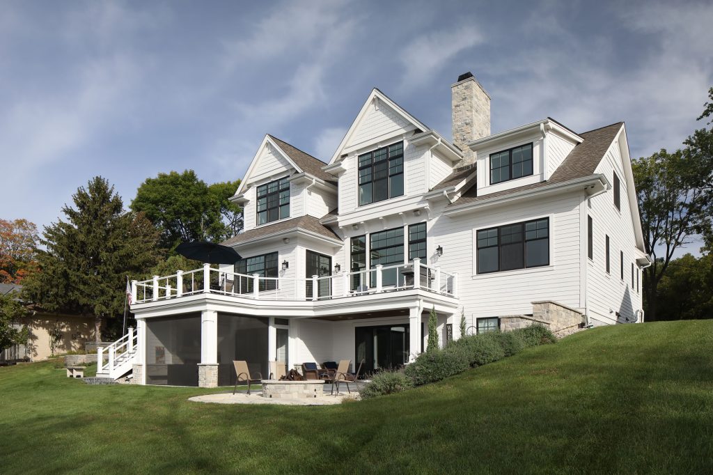 picture of a white house with a fire pit